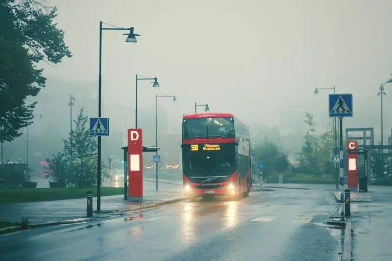 Double-decker bus in fog at Jönköping, Sweden bus stop.