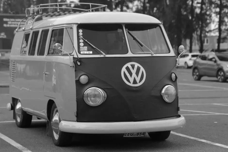 Black and white photo of a vintage Volkswagen van in a Jönköping parking lot.